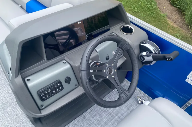 Slide: The Image of 2026 Sun Tracker Party Barge 20 DLX steering console with modern controls and sleek design. - 10