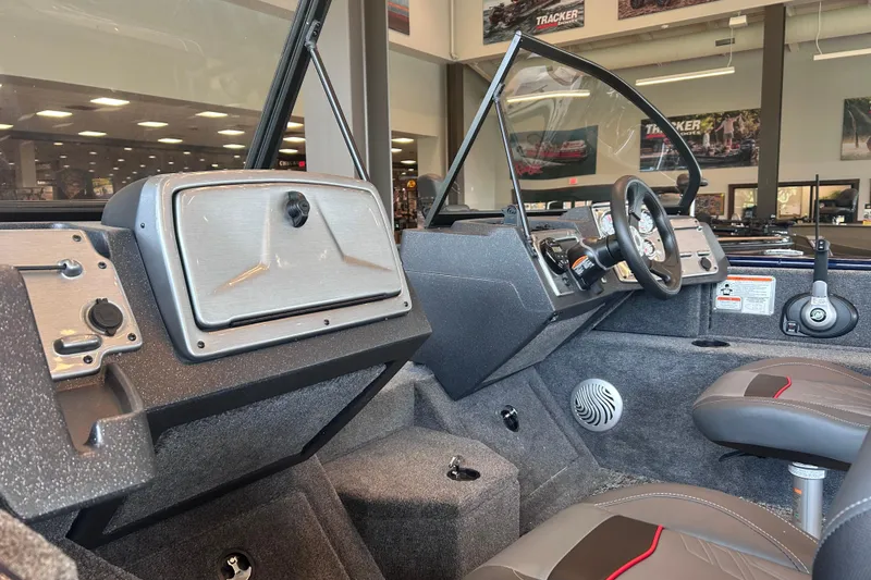Slide: The Image of Interior view of 2026 Tracker Pro Guide V-175 WT boat with modern dashboard and seating. - 13