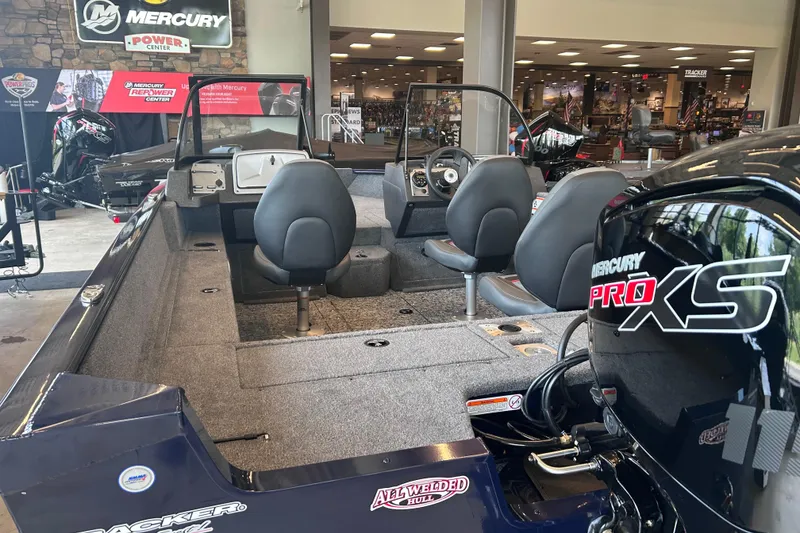 Slide: The Image of 2026 Tracker Pro Guide V-175 WT boat with Mercury Pro XS engine in showroom. - 10