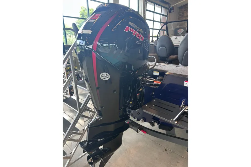 Slide: The Image of 2026 Tracker Pro Guide V-175 WT with Mercury Pro outboard motor in showroom. - 8