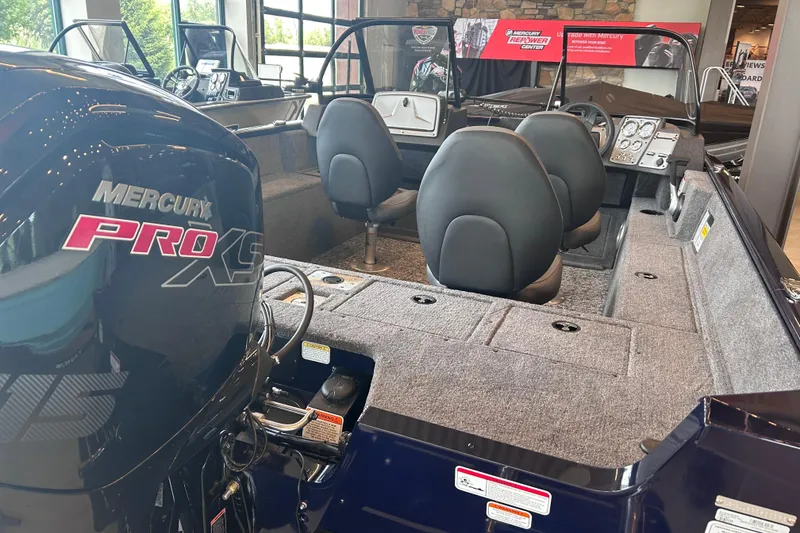 Slide: The Image of 2026 Tracker Pro Guide V-175 WT boat interior with Mercury Pro XS engine. - 7