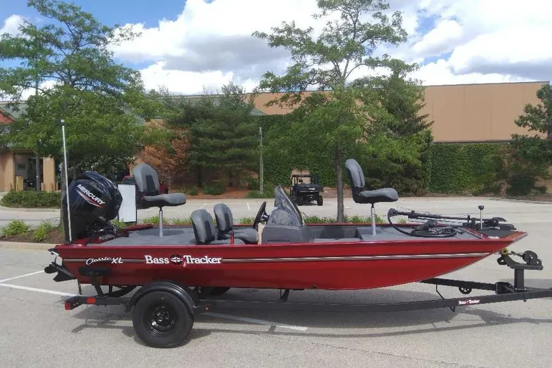 The Image of 2026 Tracker Bass Tracker Classic XL boat on trailer in parking lot. - 0