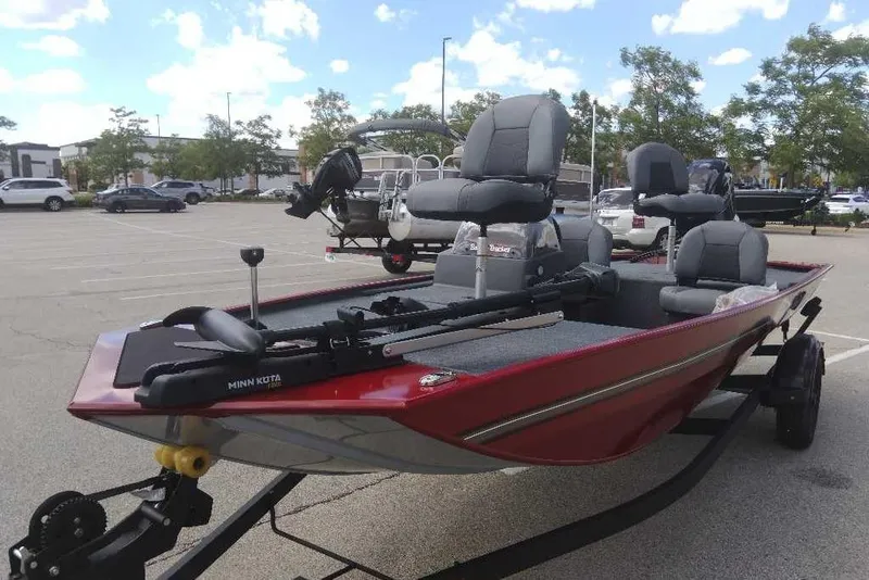 Slide: The Image of 2026 Tracker Bass Tracker Classic XL boat in parking lot, featuring Minn Kota trolling motor. - 3