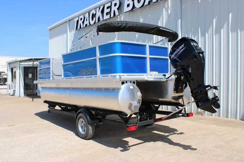 Slide: The Image of 2026 Sun Tracker Party Barge 18 DLX pontoon boat with Mercury engine at dealership. - 3