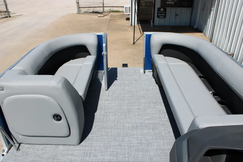 Slide: The Image of 2026 Sun Tracker Party Barge 18 DLX interior with gray seating and spacious layout. - 8