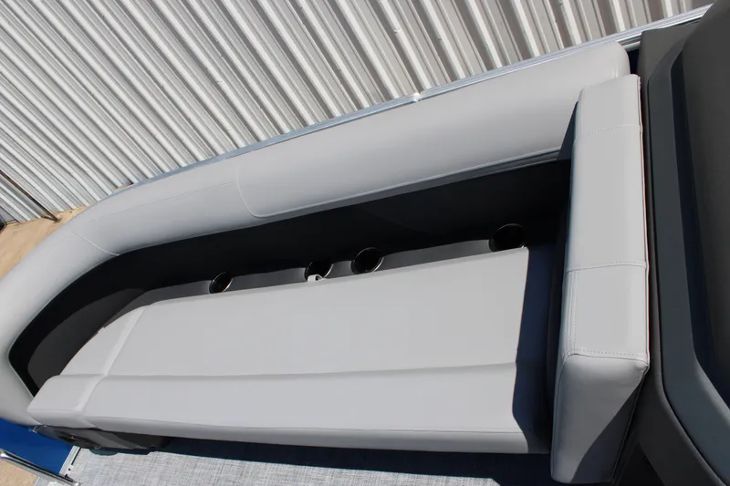 Slide: The Image of 2026 Sun Tracker Party Barge 18 DLX seating with cup holders, gray upholstery. - 14