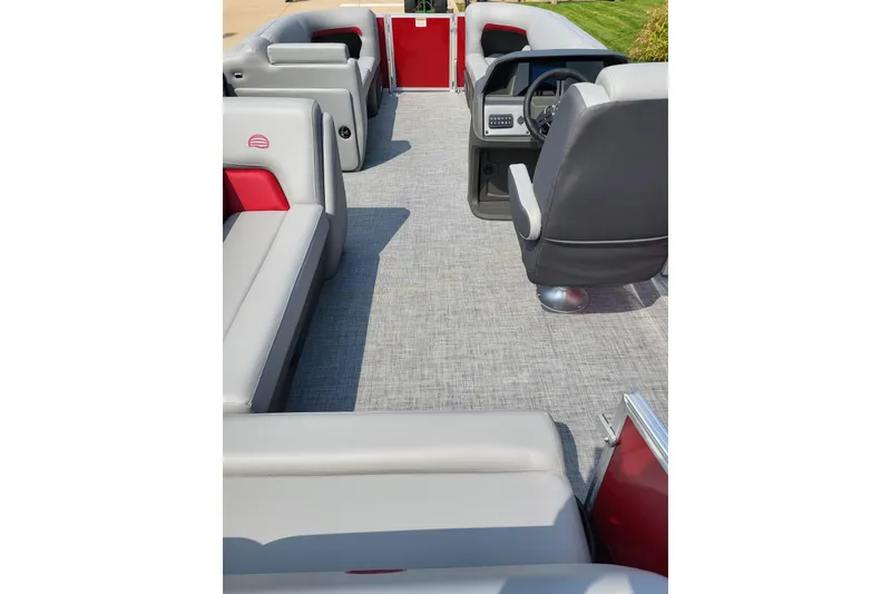 Slide: The Image of 2026 Sun Tracker Party Barge 20 DLX interior with gray and red seating. - 2