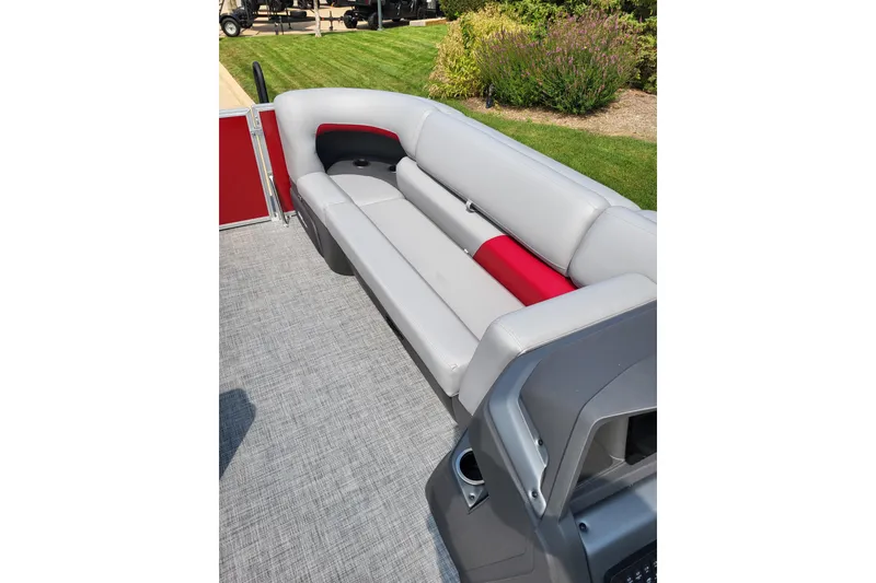 Slide: The Image of 2026 Sun Tracker Party Barge 20 DLX interior with gray and red seating. - 6