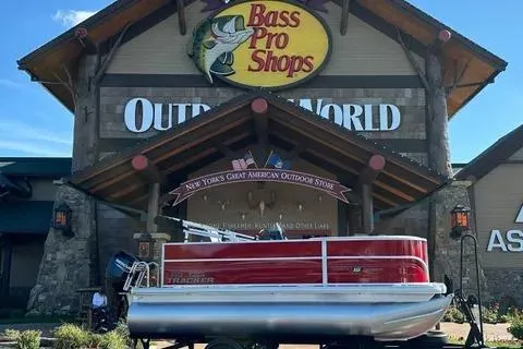 The Image of 2026 Sun Tracker Party Barge 16 DLX displayed at Bass Pro Shops Outdoor World. - 0
