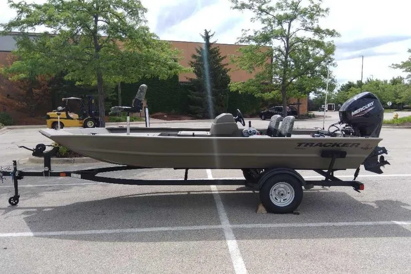 The Image of 2026 Tracker Grizzly 1754 SC boat on trailer in parking lot. - 0
