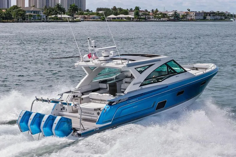 The Image of 2023 Formula 430 Super Sport Crossover cruising on water, showcasing sleek design and powerful engines. - 0