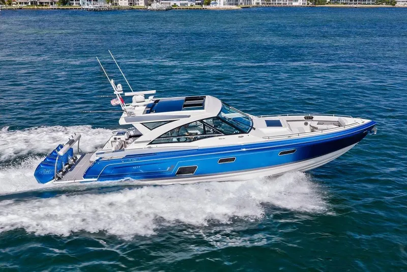Slide: The Image of 2023 Formula 430 Super Sport Crossover cruising on open water, showcasing sleek design and performance. - 12