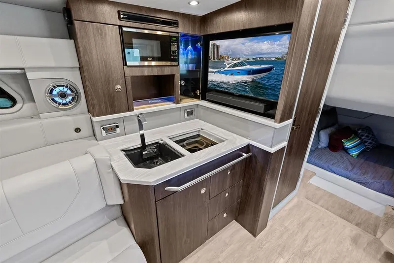 Slide: The Image of Luxurious interior of 2023 Formula 430 Super Sport Crossover yacht with modern kitchenette. - 17