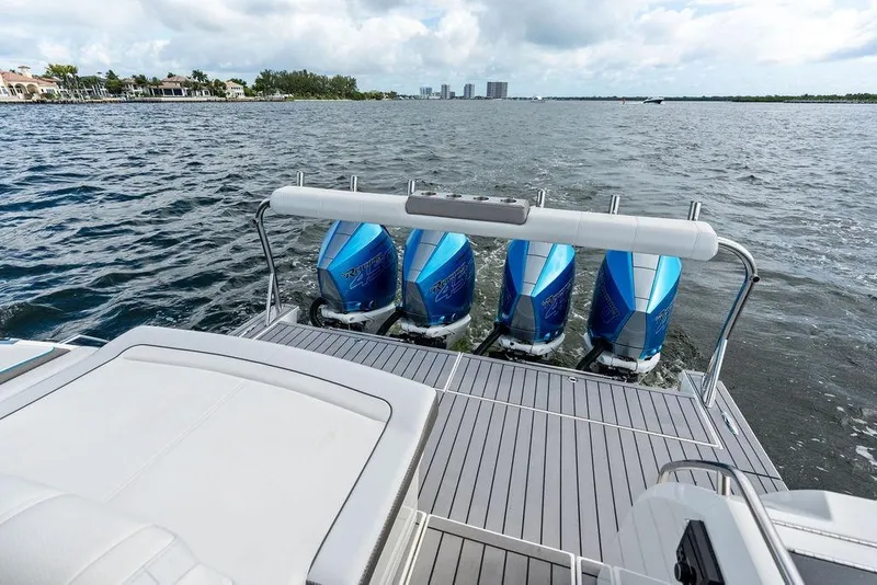 Slide: The Image of 2023 Formula 430 Super Sport Crossover with quad outboard engines on water. - 27