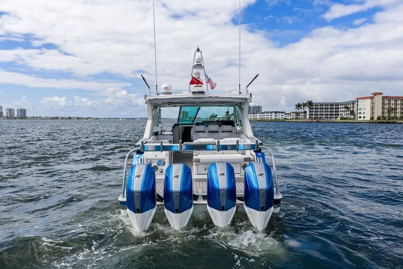 Slide: The Image of 2023 Formula 430 Super Sport Crossover boat on water, rear view with four engines. - 3