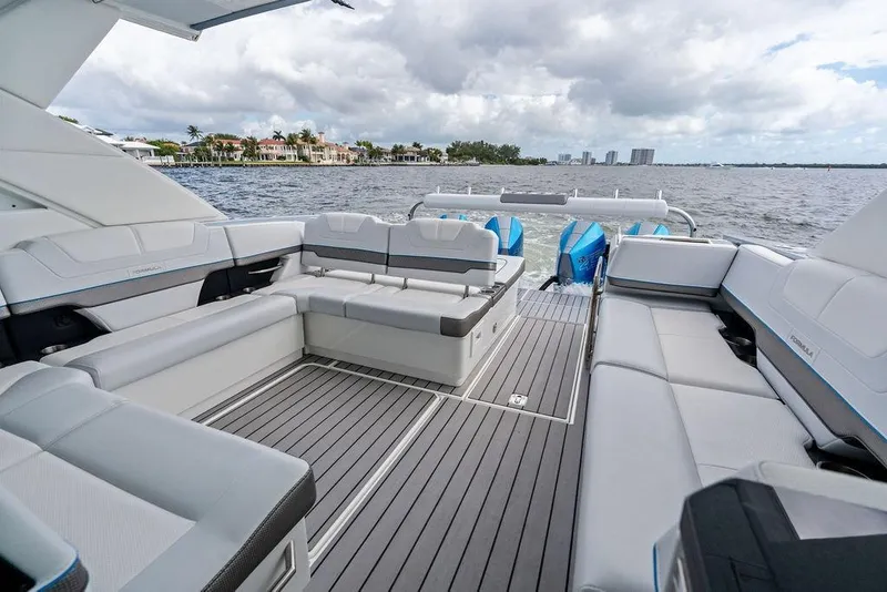 Slide: The Image of 2023 Formula 430 Super Sport Crossover luxury boat interior with spacious seating on open water. - 31