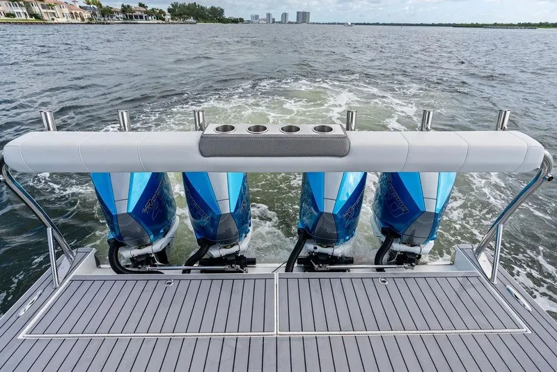 Slide: The Image of 2023 Formula 430 Super Sport Crossover with four powerful outboard engines on water. - 33