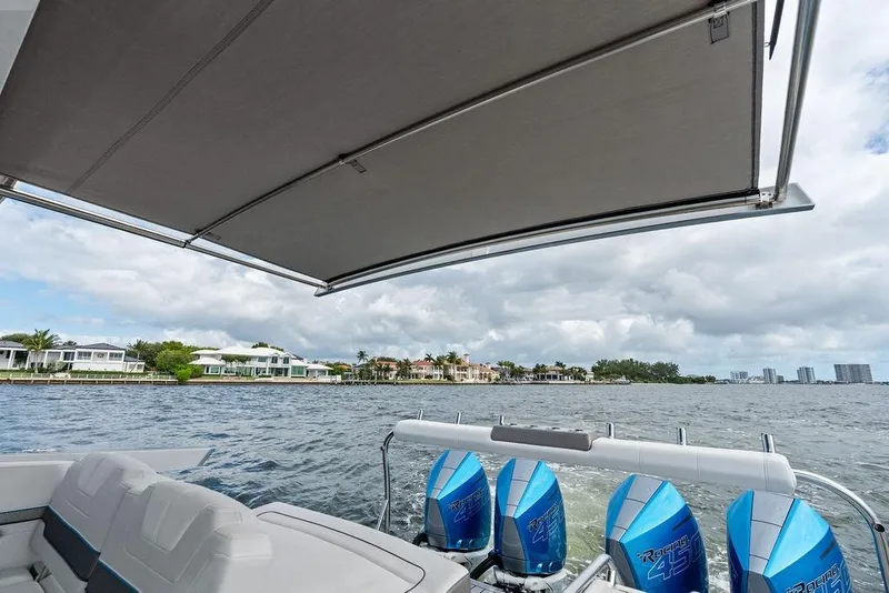 Slide: The Image of 2023 Formula 430 Super Sport Crossover on water, featuring powerful outboard engines. - 38