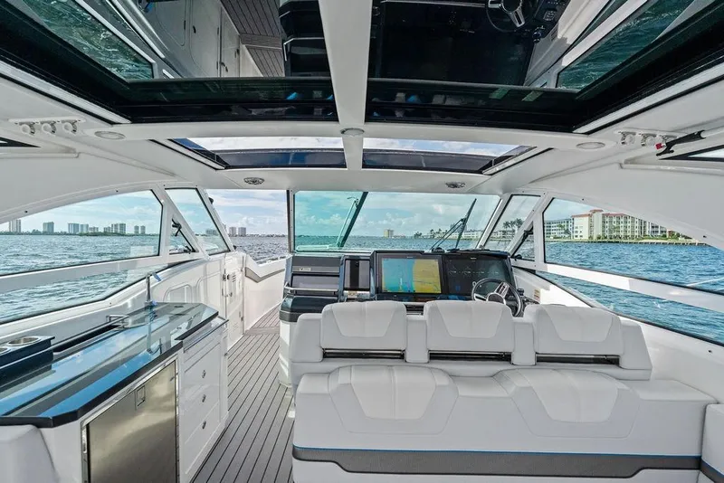 Slide: The Image of Interior of 2023 Formula 430 Super Sport Crossover yacht with luxurious seating and navigation displays. - 45