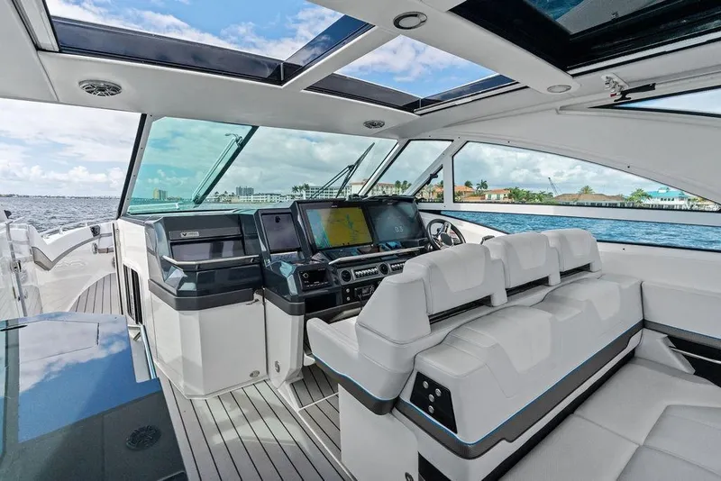 Slide: The Image of Luxurious interior of 2023 Formula 430 Super Sport Crossover yacht with modern helm and seating. - 47