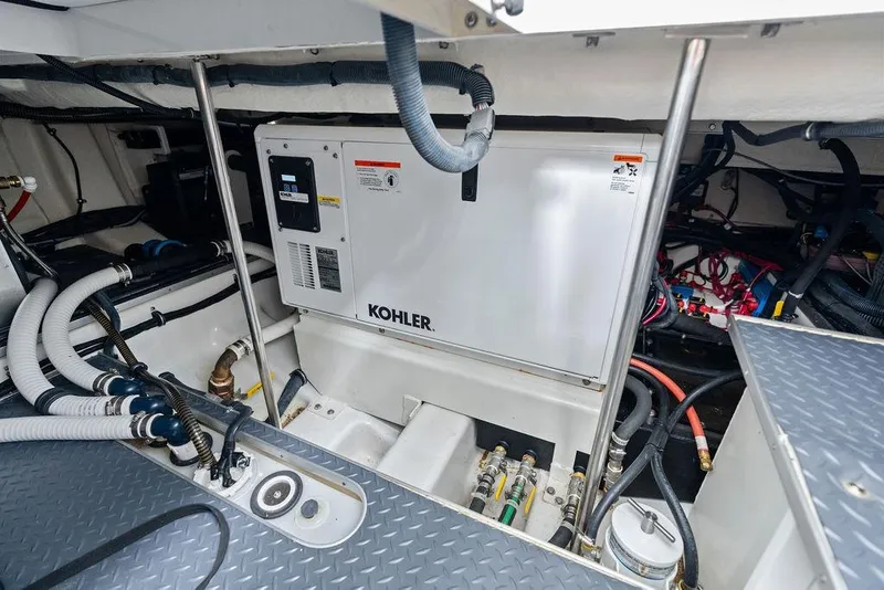 Slide: The Image of Engine room of 2023 Formula 430 Super Sport Crossover with Kohler generator and wiring. - 49
