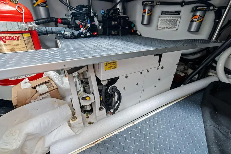 Slide: The Image of Engine compartment of 2023 Formula 430 Super Sport Crossover with fire extinguisher and wiring. - 50