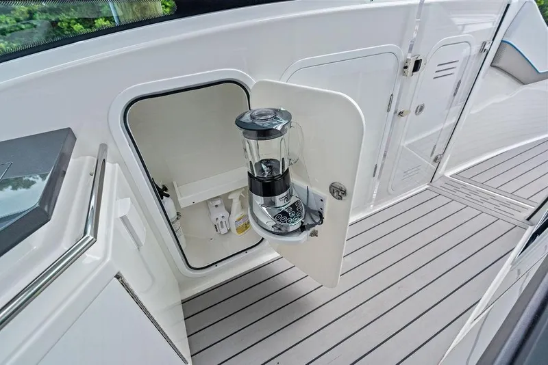 Slide: The Image of 2023 Formula 430 Super Sport Crossover boat with built-in blender in storage compartment. - 52
