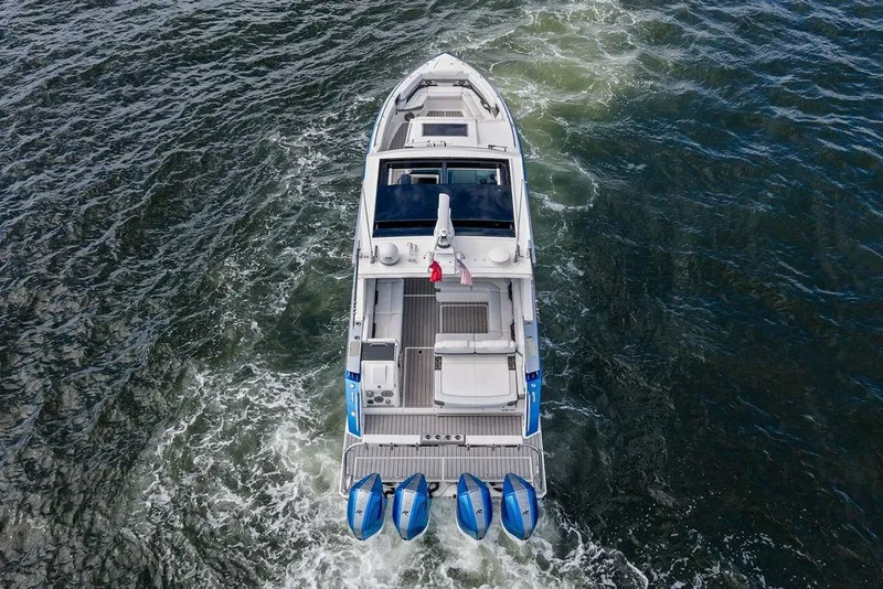 Slide: The Image of Aerial view of 2023 Formula 430 Super Sport Crossover boat cruising on water. - 6