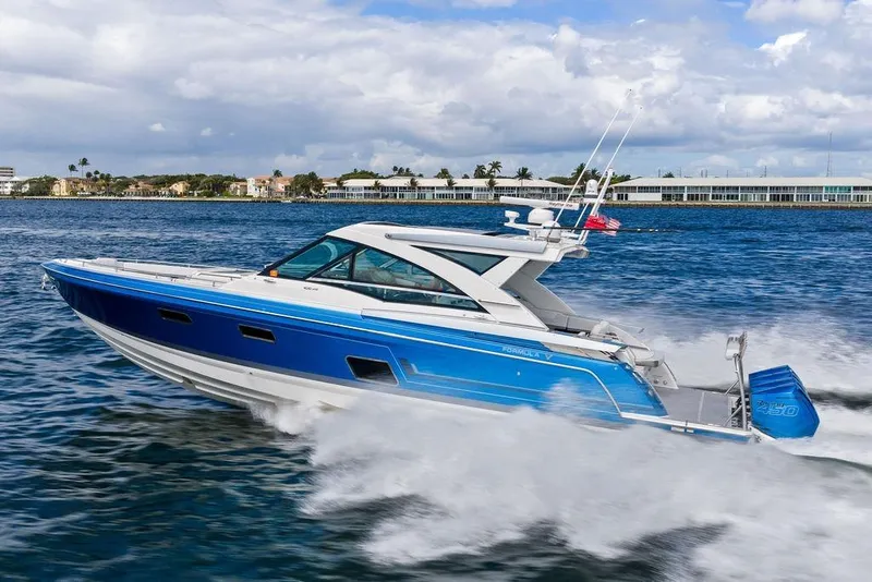 Slide: The Image of 2023 Formula 430 Super Sport Crossover cruising on open water, showcasing sleek design and speed. - 9