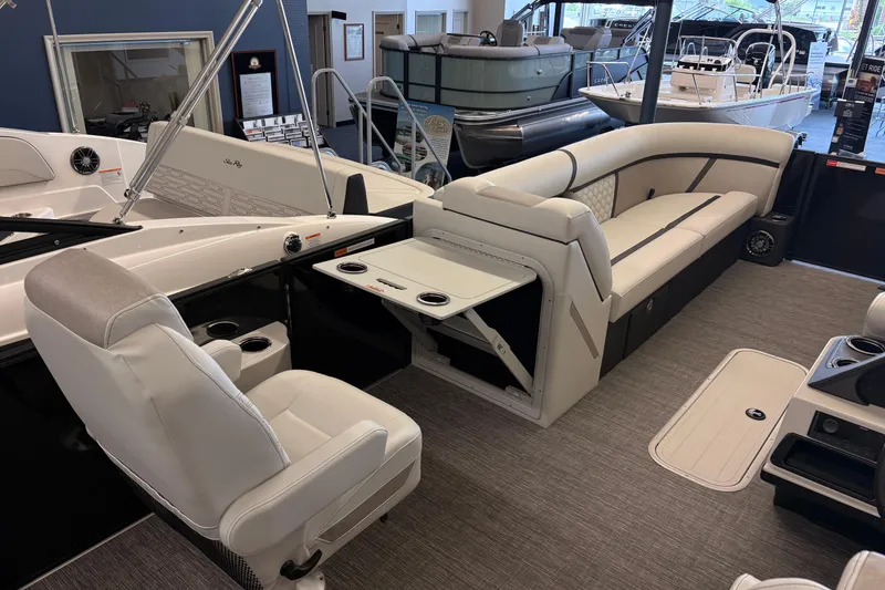 Slide: The Image of Interior of 2026 Crest Conquest 250 SLSC boat with luxurious seating and modern design. - 11