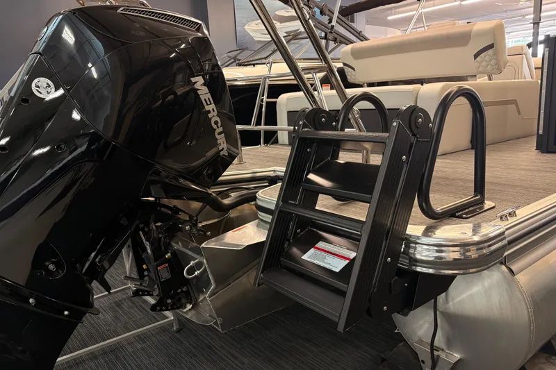 Slide: The Image of 2026 Crest Conquest 250 SLSC boat with Mercury outboard motor and boarding ladder. - 14