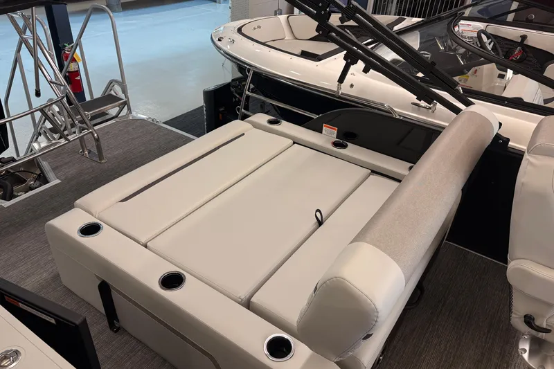 Slide: The Image of 2026 Crest Conquest 250 SLSC boat interior with plush seating and cup holders. - 15