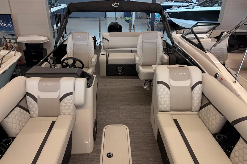 Slide: The Image of 2026 Crest Conquest 250 SLSC boat interior with luxurious seating and modern design. - 5