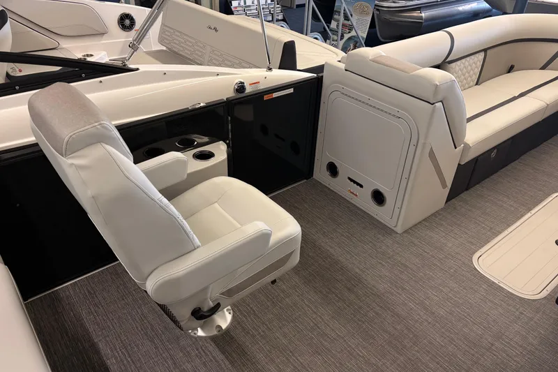 Slide: The Image of Interior of 2026 Crest Conquest 250 SLSC boat with plush seating and modern design. - 7