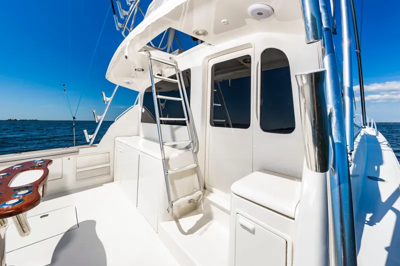 Slide: The Image of Ocean 48 SuperSport 2000 yacht deck with blue sky and sea. - 12
