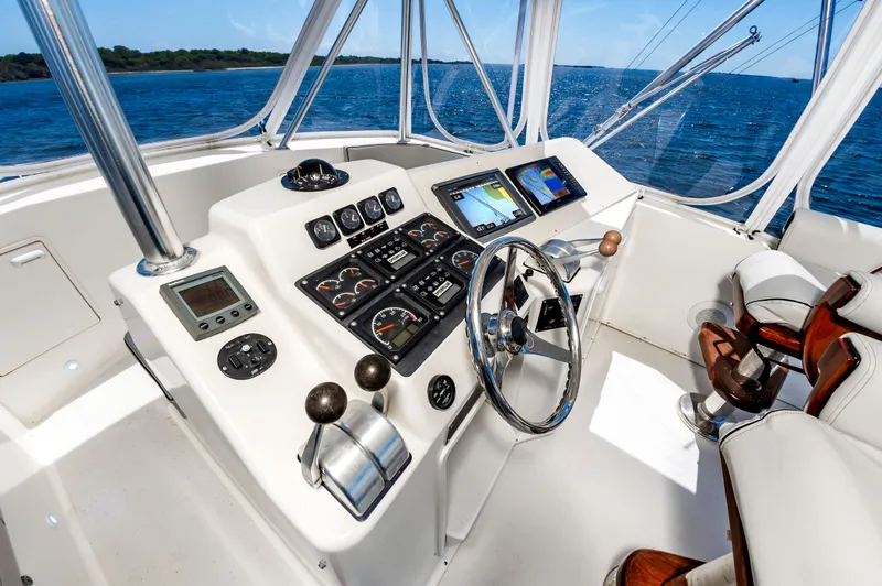 Slide: The Image of Helm of Ocean 48 SuperSport yacht, 2000 model, overlooking the sea. - 17