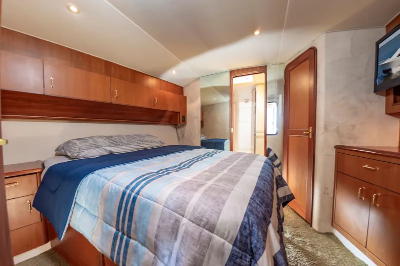 Slide: The Image of Interior of 2000 Ocean 48 SuperSport yacht featuring cozy bedroom. - 33