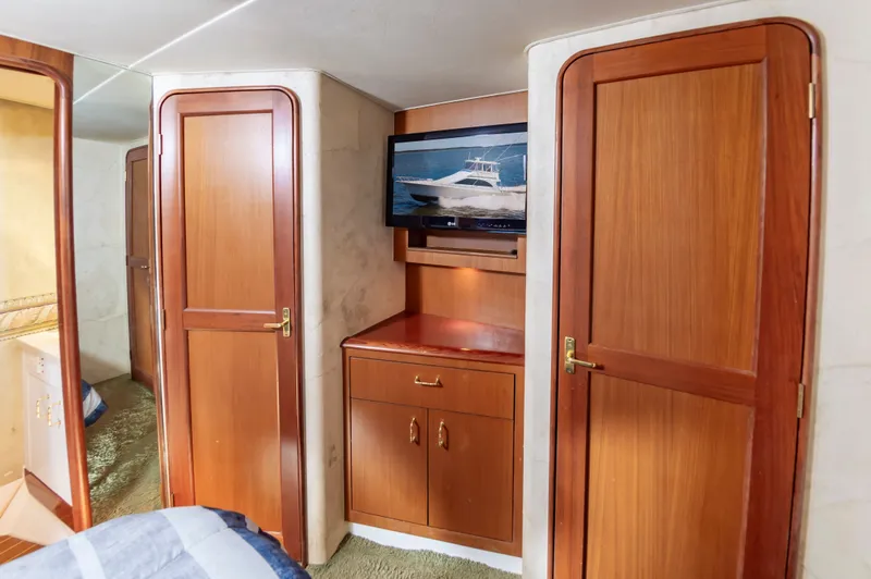Slide: The Image of Interior of 2000 Ocean 48 SuperSport yacht with wooden cabinetry. - 35