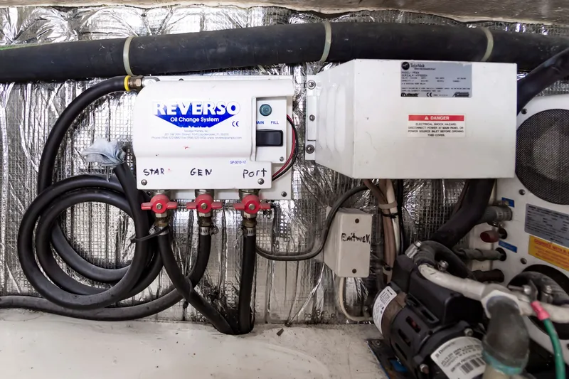 Slide: The Image of Reverso oil change system in Ocean 48 SuperSport 2000 engine room. - 45