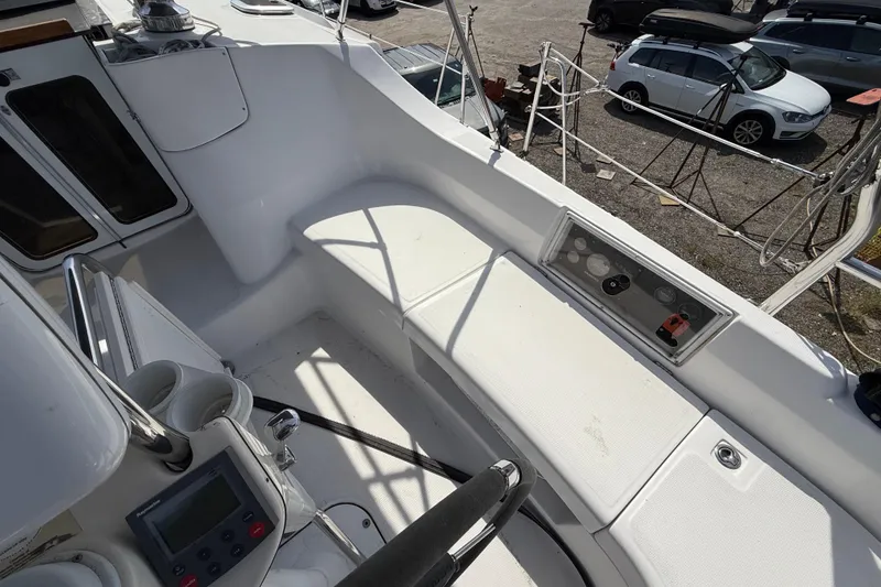 Slide: The Image of Cockpit view of 2005 Hunter 41 Deck Salon sailboat, featuring seating and control panel. - 14