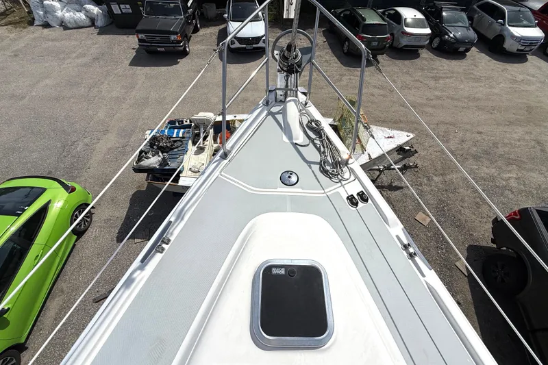 Slide: The Image of 2005 Hunter 41 Deck Salon sailboat deck view in a parking lot. - 22