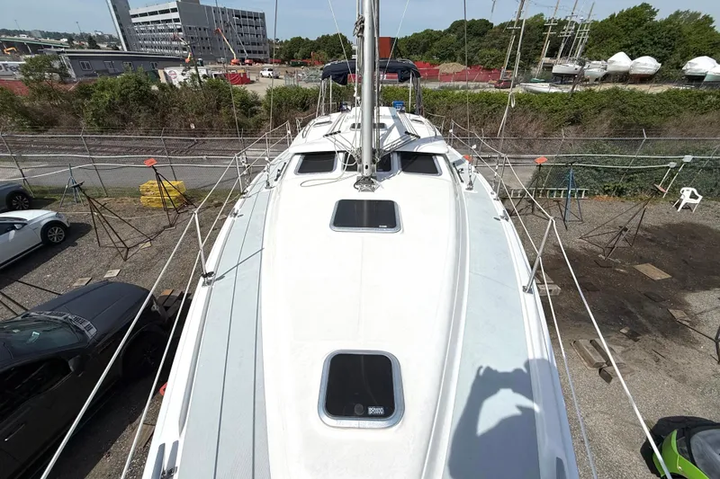 Slide: The Image of 2005 Hunter 41 Deck Salon sailboat on land, viewed from above, in a boatyard setting. - 23