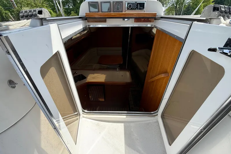 Slide: The Image of 2005 Hunter 41 Deck Salon interior view through open cabin doors. - 29