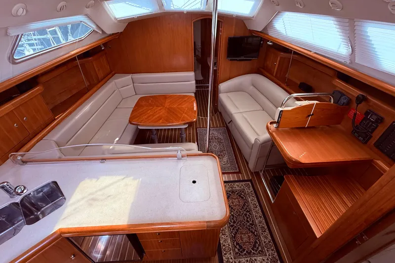 Slide: The Image of Luxurious interior of 2005 Hunter 41 Deck Salon yacht with elegant wood finishes. - 30