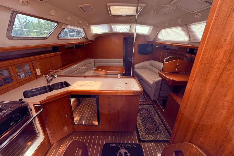 Slide: The Image of Luxurious interior of 2005 Hunter 41 Deck Salon yacht with elegant wood finishes. - 31