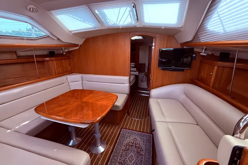Slide: The Image of Luxurious interior of 2005 Hunter 41 Deck Salon yacht with elegant wood finishes. - 42