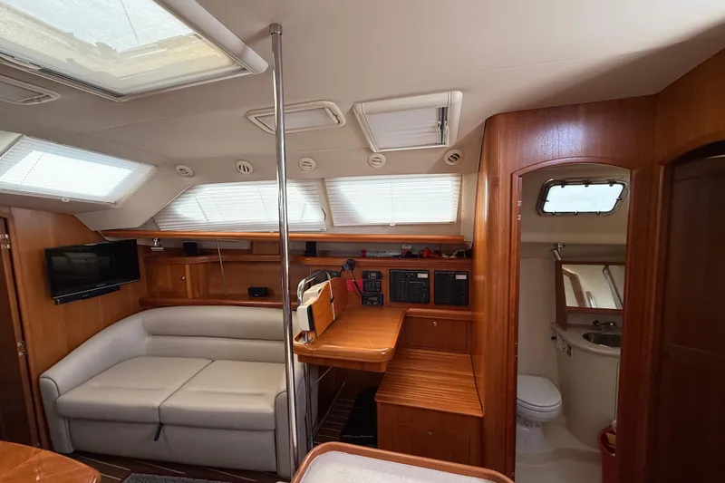 Slide: The Image of Interior of 2005 Hunter 41 Deck Salon yacht with cozy seating and modern amenities. - 43