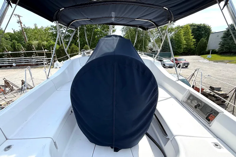 Slide: The Image of 2005 Hunter 41 Deck Salon sailboat cockpit with covered wheel and canopy. - 6