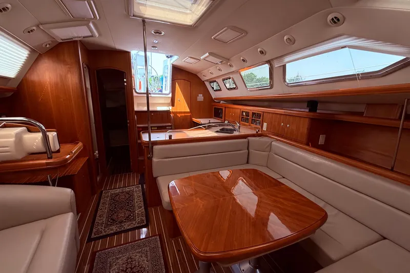 Slide: The Image of Luxurious interior of 2005 Hunter 41 Deck Salon yacht with elegant wood finishes. - 60