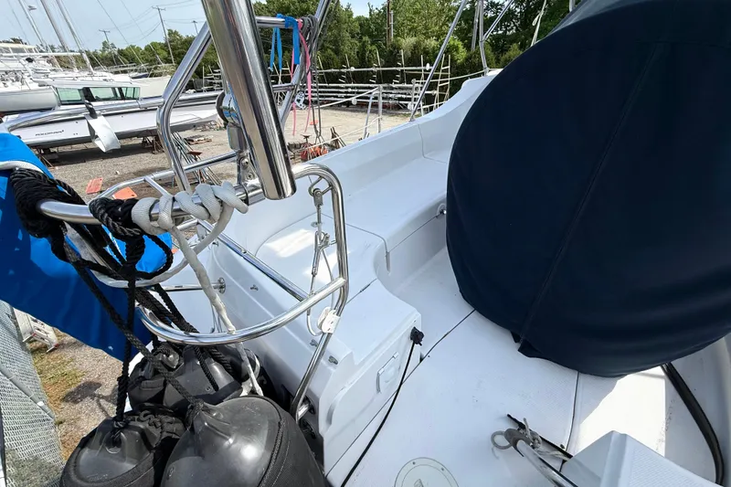 Slide: The Image of 2005 Hunter 41 Deck Salon sailboat deck with ropes and covered equipment. - 7